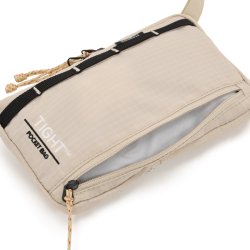 Hagl�fs Tight Pocket Bag Chalk Beige med �ben udvendig lynl�slomme